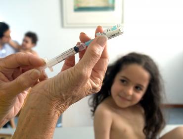 a vaccine is prepared for administring to a girl