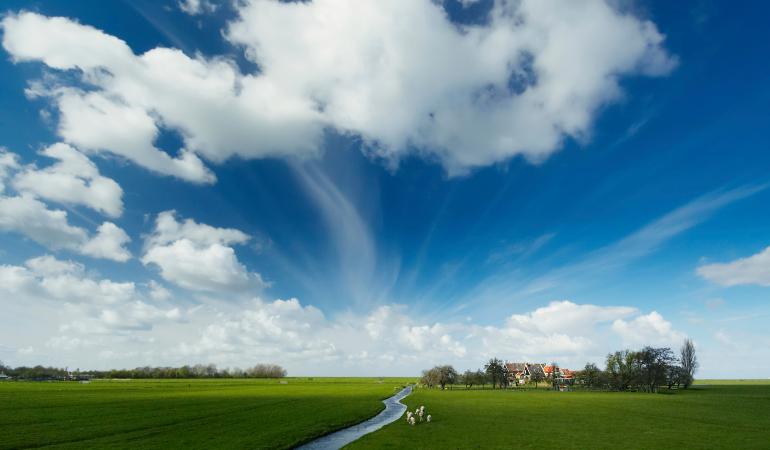 Typically Dutch landscape with clouds in the air