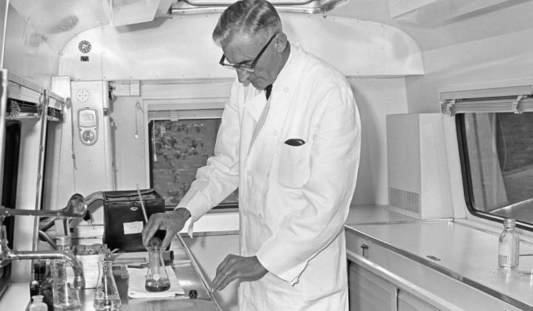 Mr Prins investigates samples in the sample and monitoring unit 1960