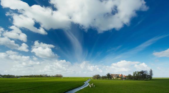 Typically Dutch landscape with clouds in the air