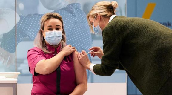 Nursing home employee receives the first COVID-19 vaccination in the Netherlands