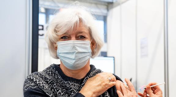 Woman receives COVID-19 vaccination