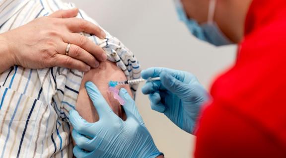 Man receives COVID-19 vaccination at GGD vaccination site