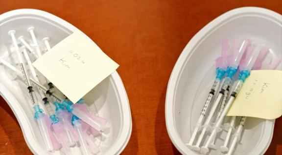 trays with COVID-19 vaccines