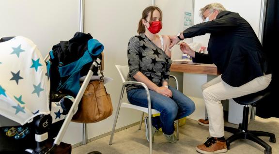 Young mother receiving COVID-19 vaccination