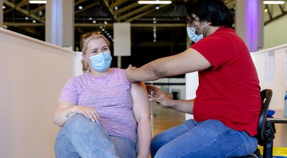 Woman receiving COVID-19 vaccination