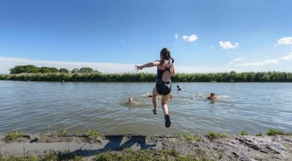 Children swimming in a lake