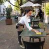 Waitress cleans patio table